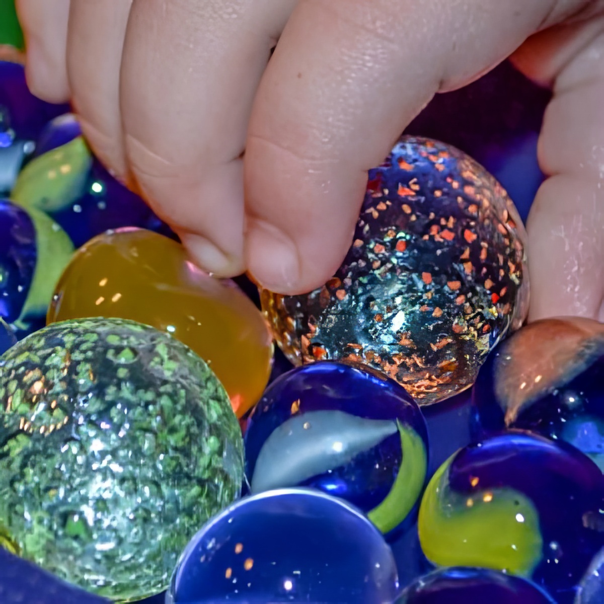 playing follows using marbles for kids of all ages