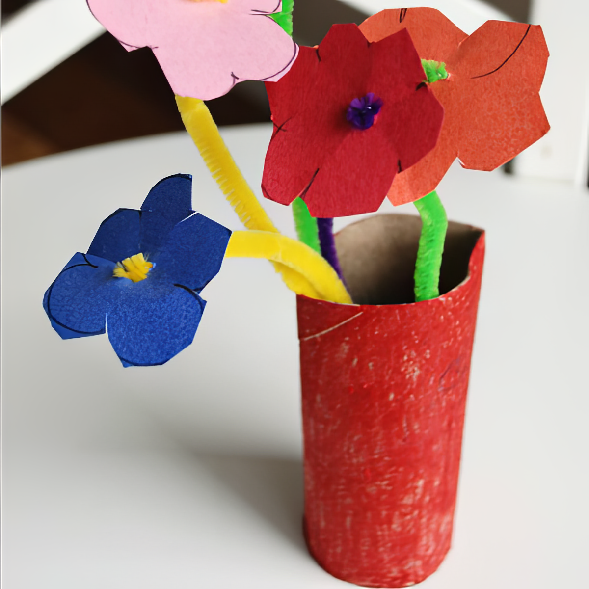 pipecleaner flowers upcycled vase using toilet paper rolls and colored papers