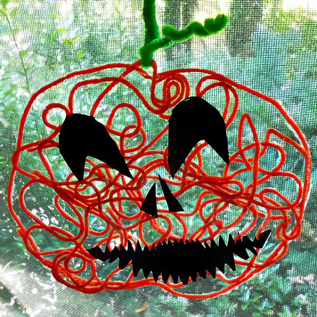 Yarn-Art-Pumpkin-Jack-OLantern-Halloween-Craft-for-Kids-at-Naturally-Educational
