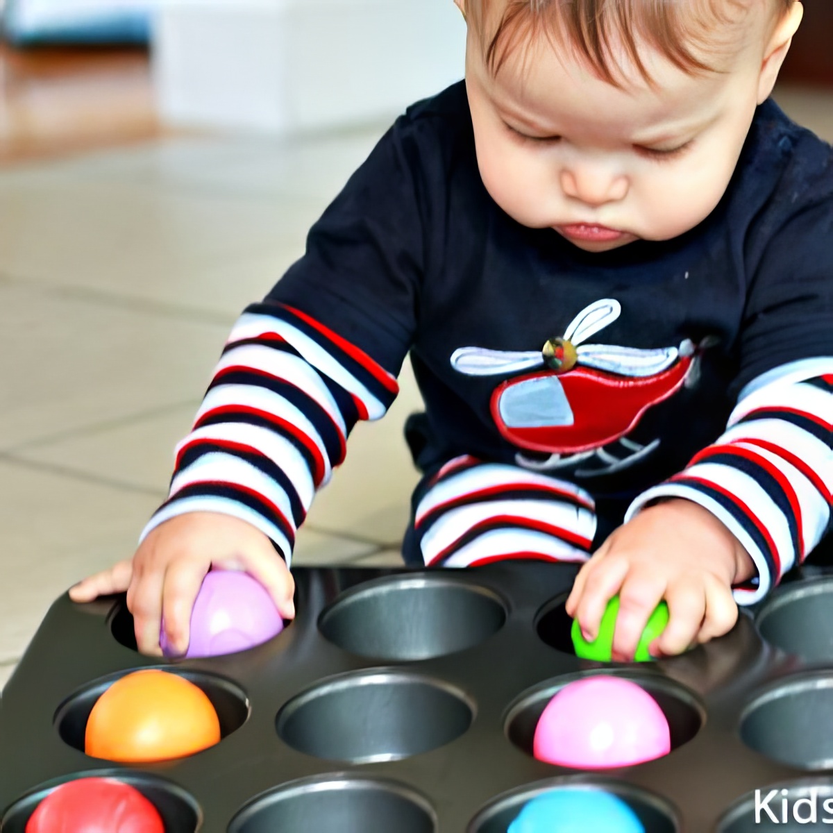balls-and-muffin-tins. Muffin Tin Game. Activities for 1-Year Olds