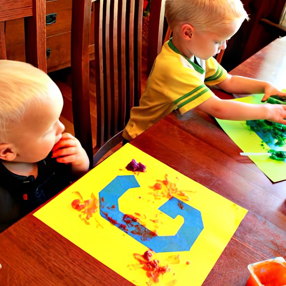 Edible finger paint pictured with toddlers. Simple Finger Painting for Toddlers with Edible Finger Paint You’ll Love. Activities for 1-Year Olds