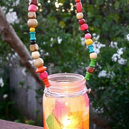 Create this tissue paper Mason Jar Lanterns at home with your kids!