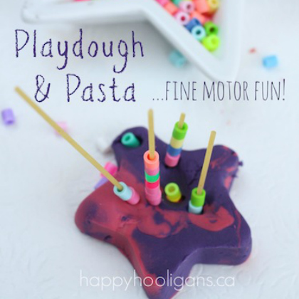 pasta and playdough stacking fine motor fun- image showing uncooked pasta sticks and beads stacked on top