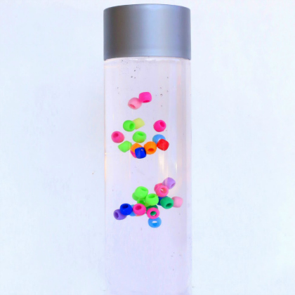 bead suspension. Colorful Pony Beads Discovery Bottle. Sensory Bottle