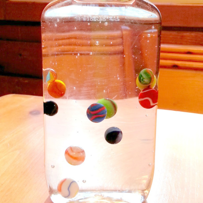 marbles in corn syrup. Marbles Discovery Bottle. Sensory Bottle