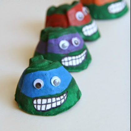 Four Green Teenage Mutant Ninja Turtle with blue, violet, red and orange mask