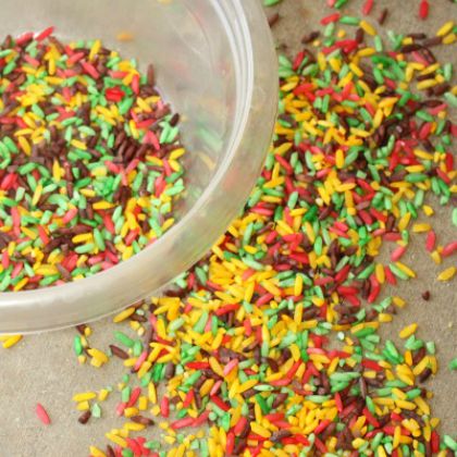 Candy Apple Rice Fall Sensory Bin by Learn Play Imagine- colored candy apple rice