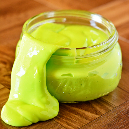 glow in the dark green slime in a jar as a night time craft for kids
