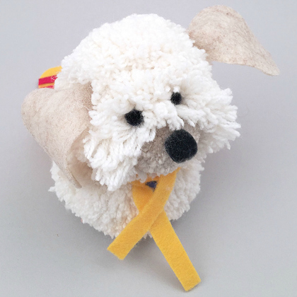 Pom Pom Puppy Craft for Kids with yellow ribbon like a stuff toy