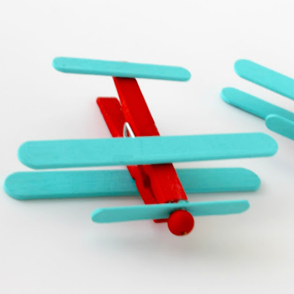 toy airplane made of popsicle and clothespin as paper plane crafts for kids