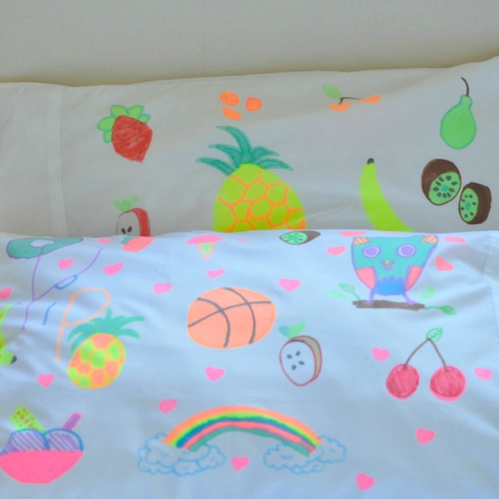 Colorful Pillowcases with doodles using colorful markers for slumber party